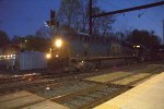 CSX 766 leads M404 in dusk.